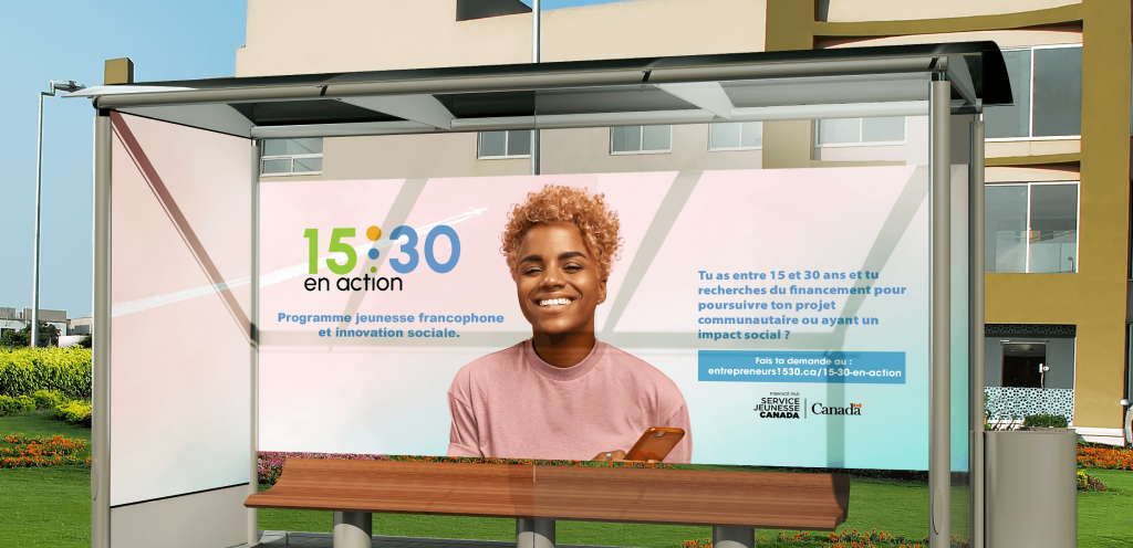 A horizontal bus stop banner advertisement featuring the 15:30 logo, text about the organization, and a smiling man in the center, holding a cellphone.