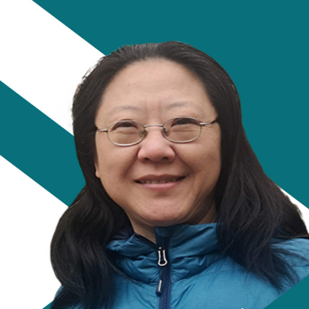 Jane Ji, Springbay Studio – wearing eyeglasses, dressed in a blue puffer jacket.